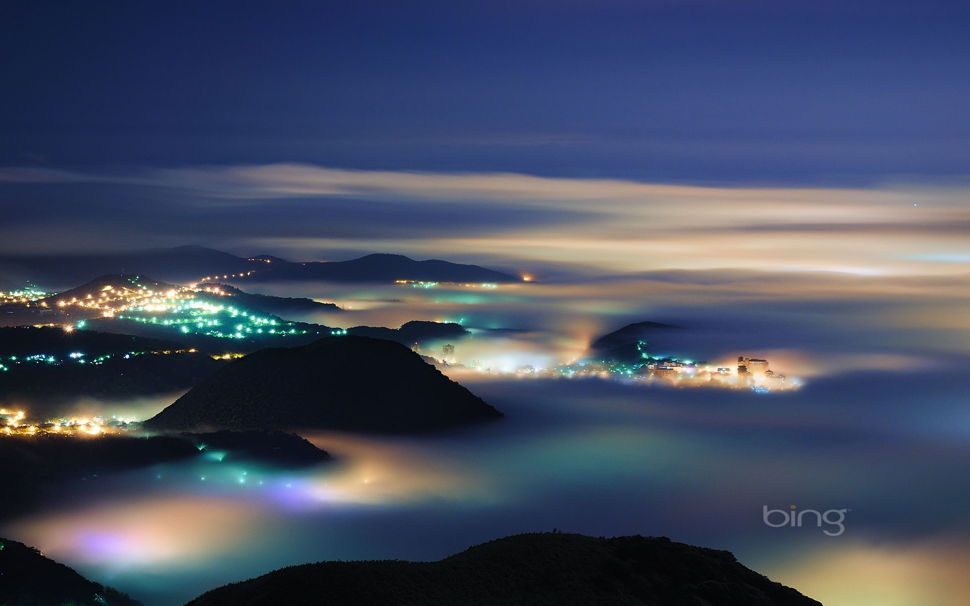 mount datun night image with fog over villages